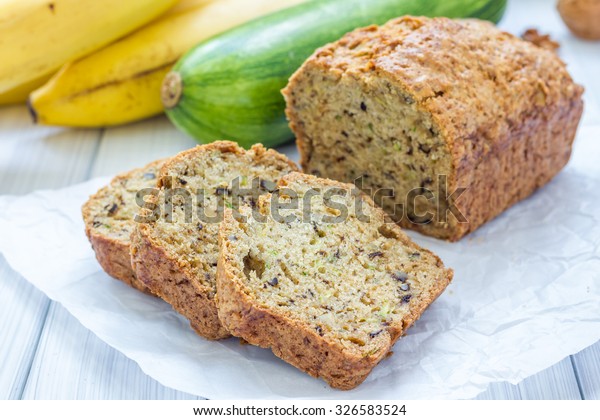 Loaf of\
homemade banana zucchini bread with\
walnuts