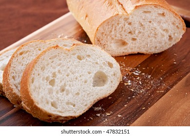 Loaf Of Thick Slice Italian Bread On A Cutting Board. Closeup Horizontal Format.