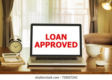 Loan approved on laptop computer screen