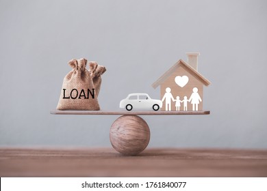 Loan Bags With Family Member And Car In A House On Balance Scale. Concept Family Financial Management, Mortgage And Payday Loan Or Cash Advance.