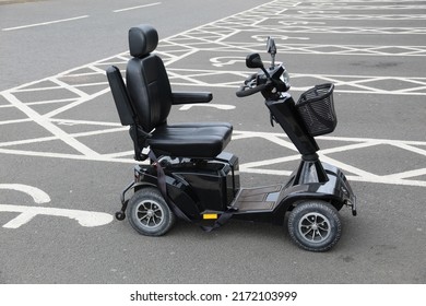 LOANHEAD, SCOTLAND - 27 June 2022 One Mobility Scooter Parked On A Disabled Parking Space At A Supermarket Car Park Near Edinburgh Scotland