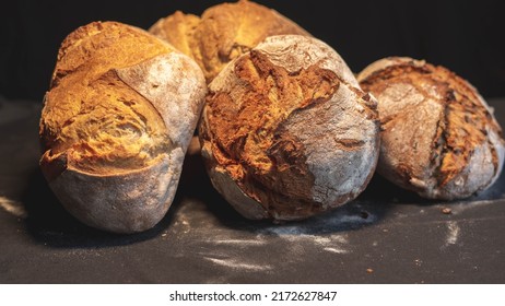loaves of bread baked with firewood and various kinds of flour - Shutterstock ID 2172627847