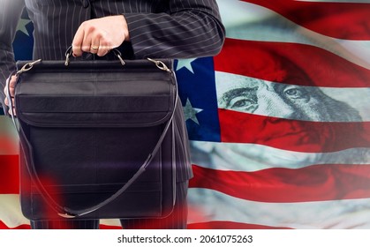 Lobbying in USA. Man with business briefcase. Metaphor for lobbying companies in America. Man in business suit against background of Stars and Stripes flag. Lobbyist services in USA. United states