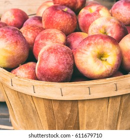 Lobo Apples In A Basket At The Market With Vintage Effect