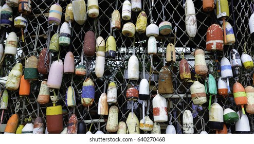 Lobster Buoys Displayed On Fishing Net