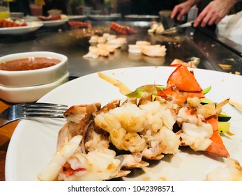 Lobster On The Plate In The Japanese Steakhouse With Chef Cooking In The He Background