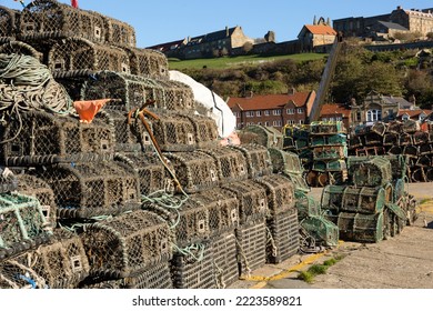 Lobster Pots On A Harbour Wall.