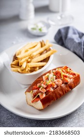 Lobster Roll With Fries On A Plate Topped With Green Onions, Gourmet Lunch