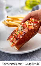 Lobster Roll Served With Fries And White Wine For Lunch Or Dinner