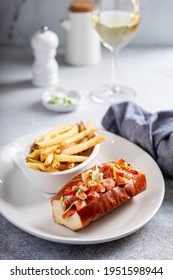 Lobster Roll Served With Fries And White Wine For Lunch Or Dinner