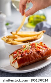 Lobster Roll Served With Fries And White Wine For Lunch Or Dinner