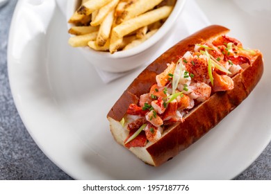 Lobster Roll Served With Fries And White Wine For Lunch Or Dinner