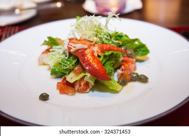 Lobster salad with lettuce and lemon sauce