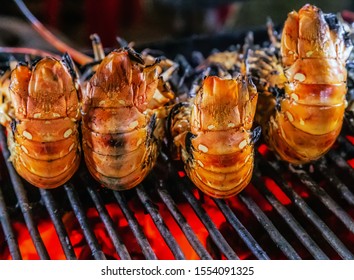 Lobster Tail Cooking Grilling On Flaming Grill Steamed (selective Focus)