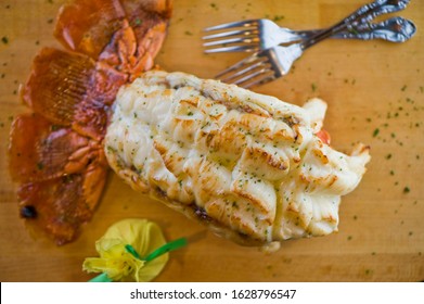 Lobster Tail, Served With Drawn Butter And Lemon Wedges. Maine Lobster Tail, Classic American Restaurant Favorite. Seasoned With Salt And Pepper And Garnished With Italian Parsley.