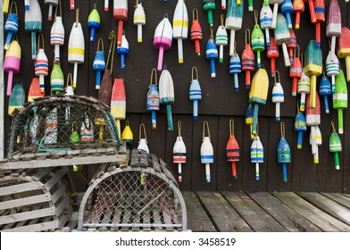 Lobster Traps And Colorful Buoys On Fisherman's House In Coastal Maine