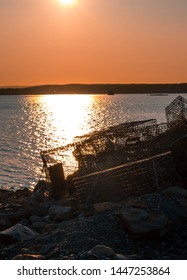 Lobster Traps Sitting On Shore During A Cape Breton Sunset