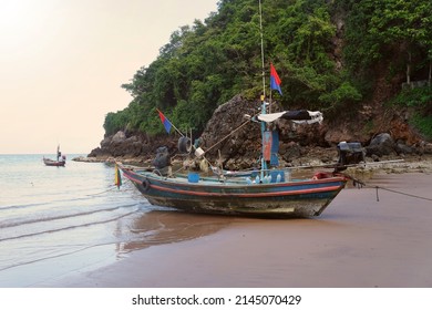 Local Asian Fisherman Boat Moored On The Beach. The Fishing Boat Departs For Fish And Squid In The Gulf Of Thailand.