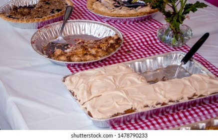 A Local Bake Sale Sells A Variety Of Pies And Cakes To Raise Money For Their Association