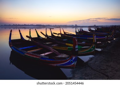 The local boat in taungthaman lake near U Bein bridge, The longest teak bridge in the world, Mandalay Myanmar - Shutterstock ID 2051454446