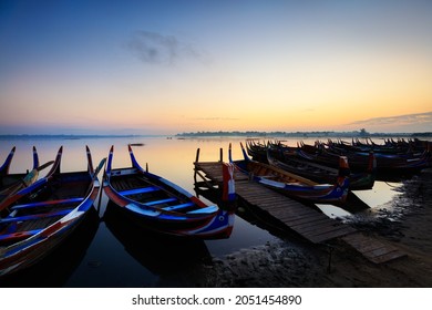 The local boat in taungthaman lake near U Bein bridge, The longest teak bridge in the world, Mandalay Myanmar - Shutterstock ID 2051454890