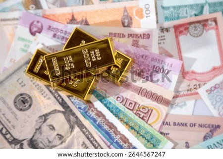 Local close ups of various foreign currencies and gold