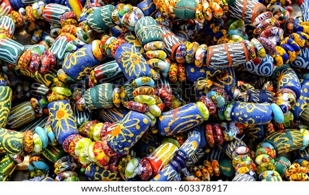 Local craft market in Africa. Unique handmade colorful beads bracelets, bangles. Craftsmanship. African fashion. Traditional ornament, accessories.