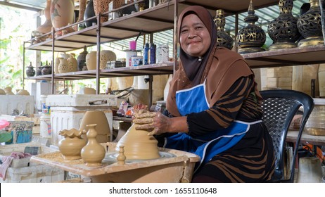 Local demonstrate on making traditional clay jar called "Labu Sayong" or Essence Jar of Sayong at Kuala Kangsar, Perak, Malaysia