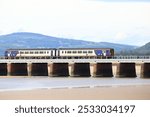 Local Diesel Train on the Arnside Viaduct over the River Kent in Cumbria.