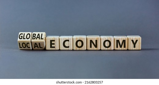 Local Or Global Economy Symbol. Turned Wooden Cubes And Changed Words 'local Economy' To 'global Economy'. Beautiful Grey Background. Business And Local Or Global Economy Concept. Copy Space.