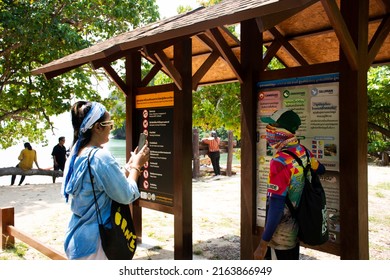 Local guide people information detail board to travelers thai women of Ao Toa Ba beach in ocean and unseen trip travel stone sea ​​heart in Pak Bara at La ngu city on April 12, 2022 in Satun, Thailand