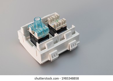 Local Network Socket Against Gray Background. Power Outlet For Accessing The Internet. Home Electrician For Repair. Data Transfer Concept. Close-up. Full Focus. Copy Space