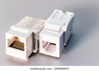 Local Network Socket Against Gray Background. Power Outlet For Accessing The Internet. Home Electrician For Repair. Data Transfer Concept. Close-up. Full Focus. Copy Space