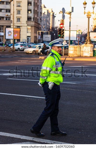 Local police man, Romanian police man, traffic\
police man (Politia Rutiera) directing traffic in Bucharest,\
Romania, 2020