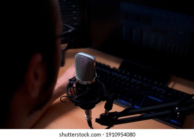 Local Radio Host In His Studio With Microphone In Main Plane