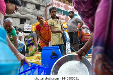 Local residents fill their containers with drinking water from a municipal tanker due to water scarcity across the India in kolkata, India on 2nd july, 2019