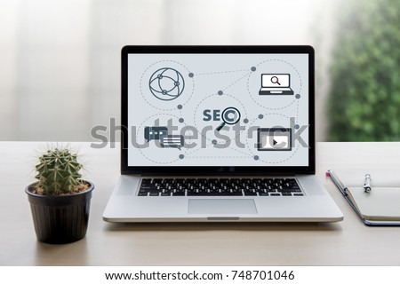 Local SEO Concept Business team hands at work with financial reports Links Global Hyperlink search engine optimization and a laptop