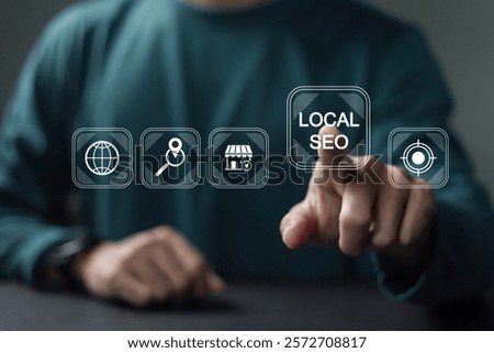 Local SEO  concept. Optimizing a website in order to increase traffic, Businessman touching local SEO icon on virtual screen for leads and brand awareness from local search.
