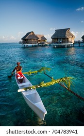 Local tahitian man was canoeing for food delivery in Tikehau island resort in French polynesia.
