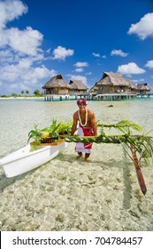 Local tahitian man was canoeing for food delivery in Tikehau island resort in French polynesia.