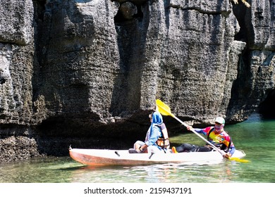 Local thai people guide paddle canoe boat of trip tour in sea ocean bring travelers women travel visit Prasat Hin Pan Yod in Mu Ko Petra National Park at Pak Bara on April 12, 2022 in Satun, Thailand