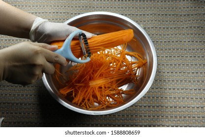 Local Traditional And Old Technology To Shredded Fresh Carrot With Hand Grater. Easy Way To Slice Carrot In Small Piece Without Complicated Machine Or Electricity. 