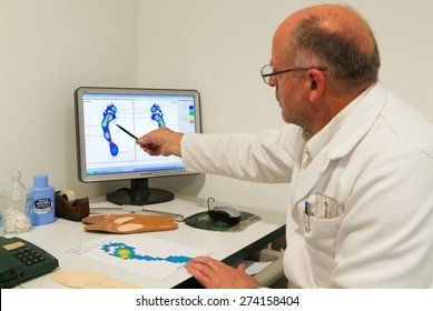 Locarno, Switzerland: 4 May 2010: Doctor preparing orthopedic insoles for a patient on his studio