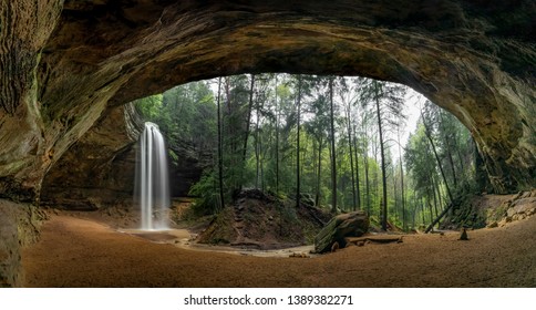 Located in the Hocking Hills of Ohio, Ash Cave is an enormous sandstone recess cave adorned with a beautiful waterfall after spring rains.