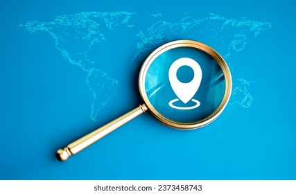 Location, pin point icon in luxury gold magnifying glass lens on world map on blue background. Global economic analysis, global investment, international business opportunity research concepts. - Powered by Shutterstock