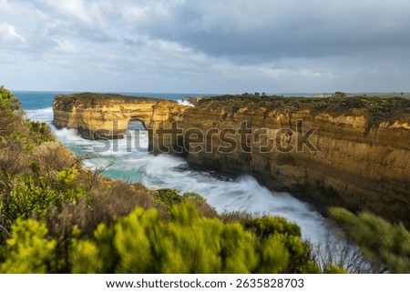 Loch Ard Gorge Natural Limestone Arch with Misty Waves, Great Ocean Road Australia