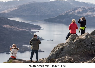 Loch Lomond And The Trossachs National Park, Scotland. 03/31/19. A Group Of People Enjoying The View Of Loch Katrine From The Top Of Ben A'an. Hiking. Adventure. Hill Walking. Landscape. UK