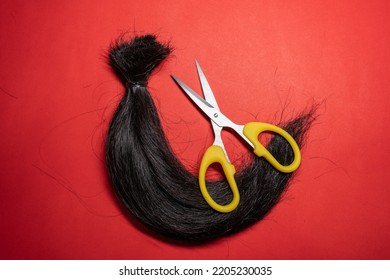 A Lock Of Hair And Scissors