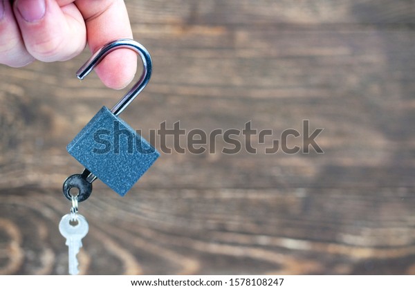 lock with keys in\
hand