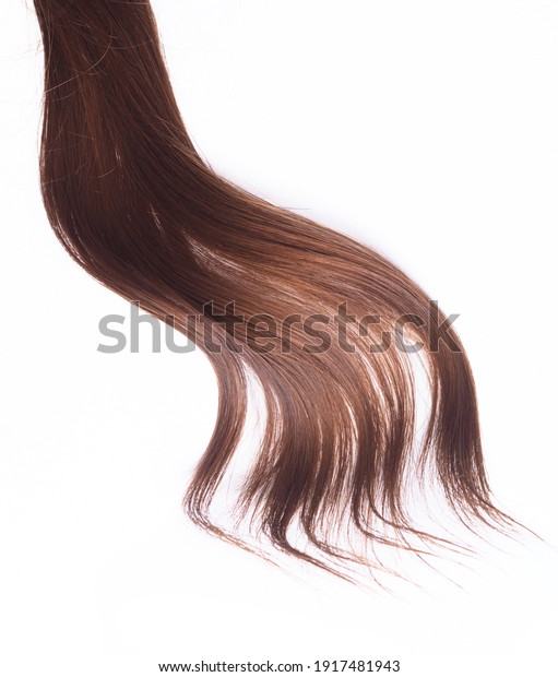 a\
lock of natural brunette hair on a white\
background